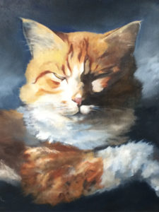 Orange cat painting; paws crossed, eyes closed contemplating its next move