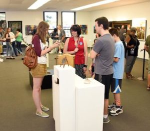 Young people viewing the art at Summit Artspace for the 2017 High Arts Festival