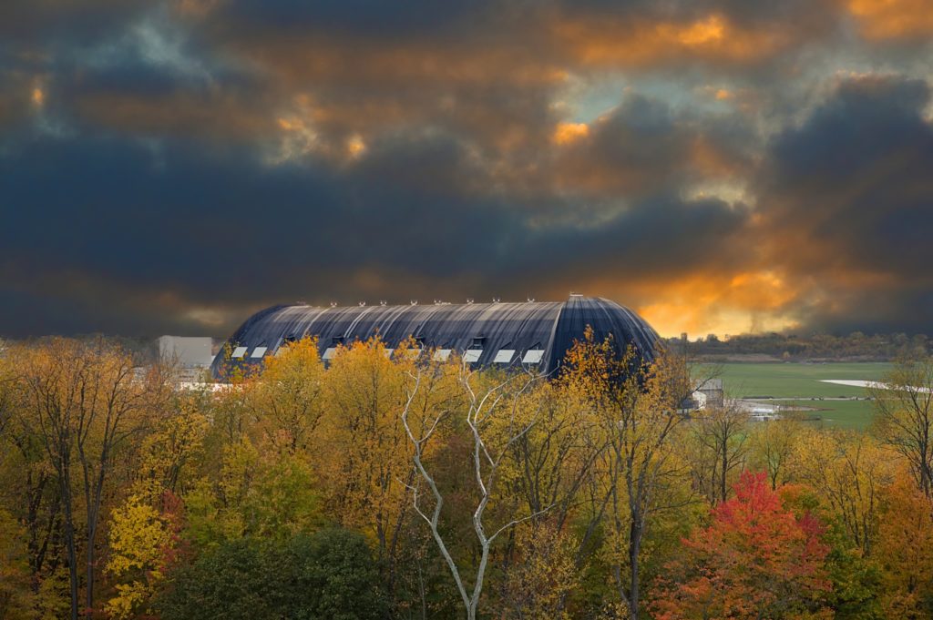 Photo of glowering fall skies over the blimp hangar in Akron Ohio
