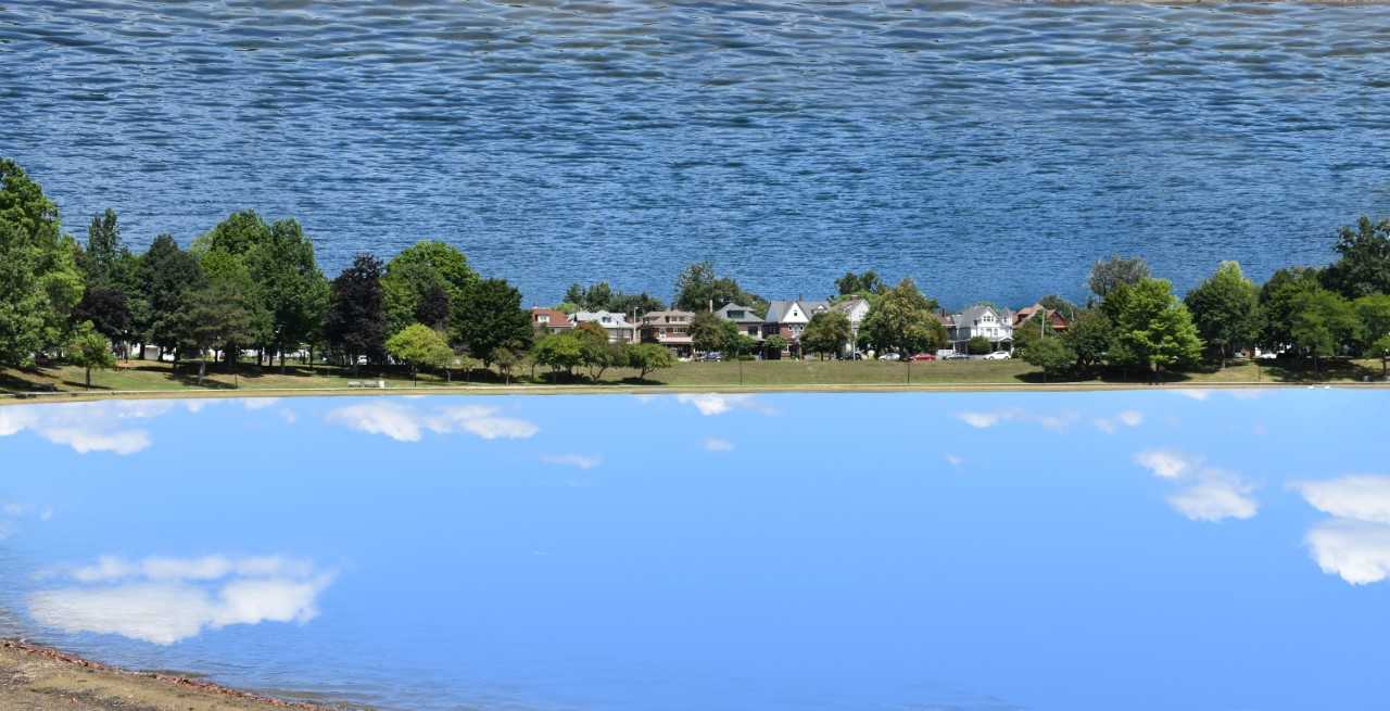 Reflection 1 by David Wood is a styled reflection of the sky over Lake Anna in Barberton OH