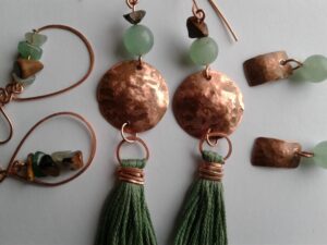 Bronze earrings with green breads and green tassels